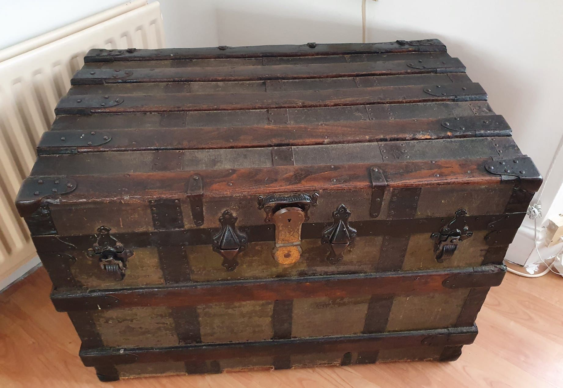 Large Vintage Wood and Metal Trunk, comes with two new leather straps. Good condition for age.