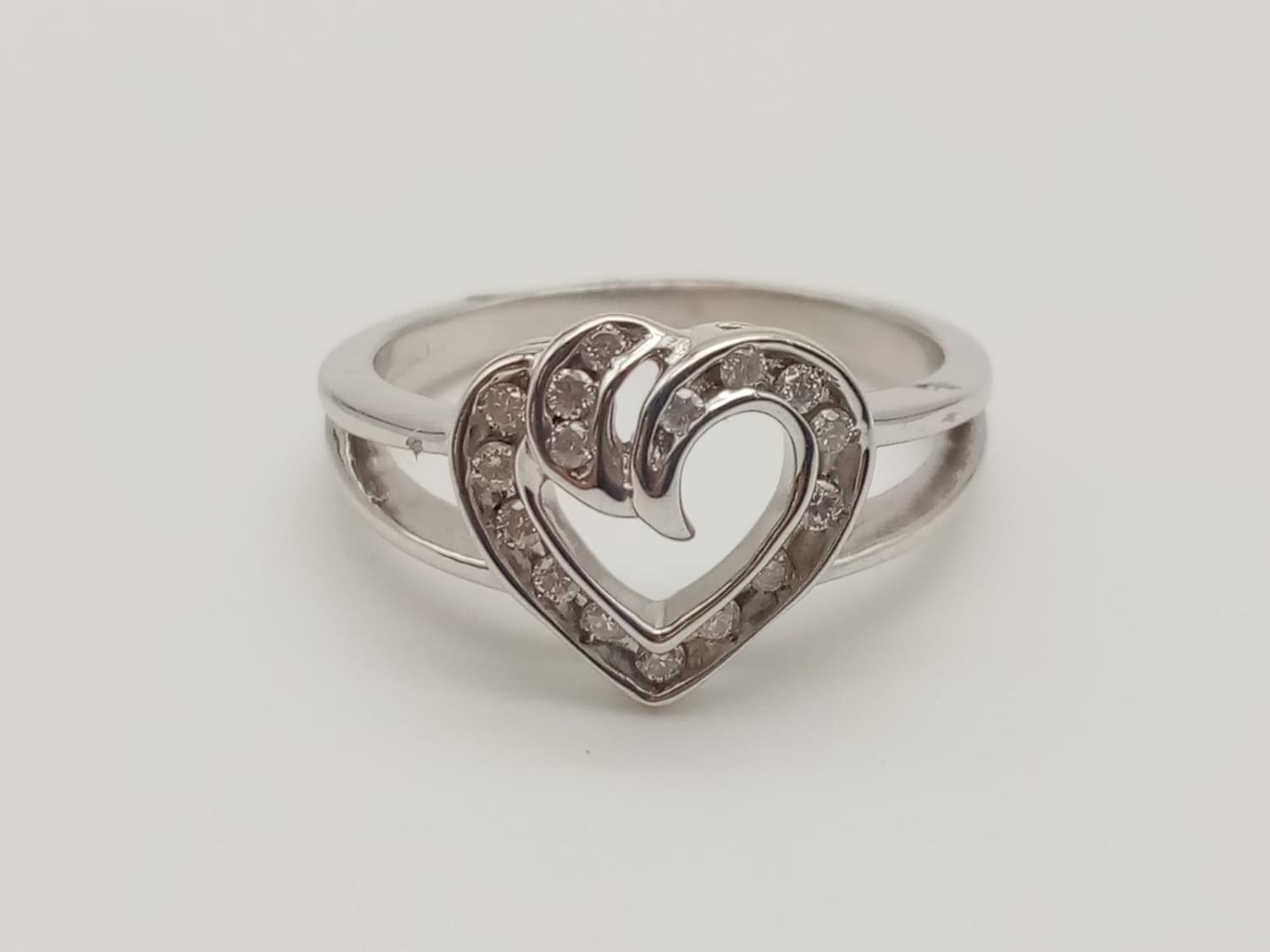 9k White gold DIAMOND SET HEART RING, weight 3.7g and approx 0.25ct diamonds, size O
