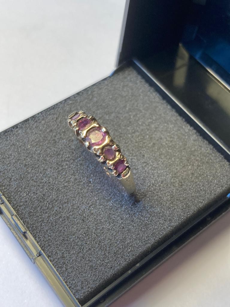 9 carat gold ring having five graduated amethysts to top. Full UK hallmark ,size P.