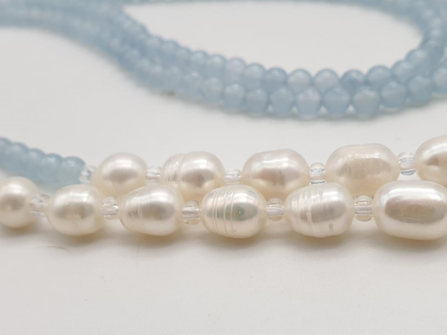 Three very long rows (128cm!) of aquamarine (colour enhanced) and natural pearls that can form a - Image 7 of 10