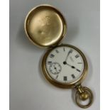 Vintage full hunter Waltham pocket watch in gold filled Canadian case , ticks but stops no glass .