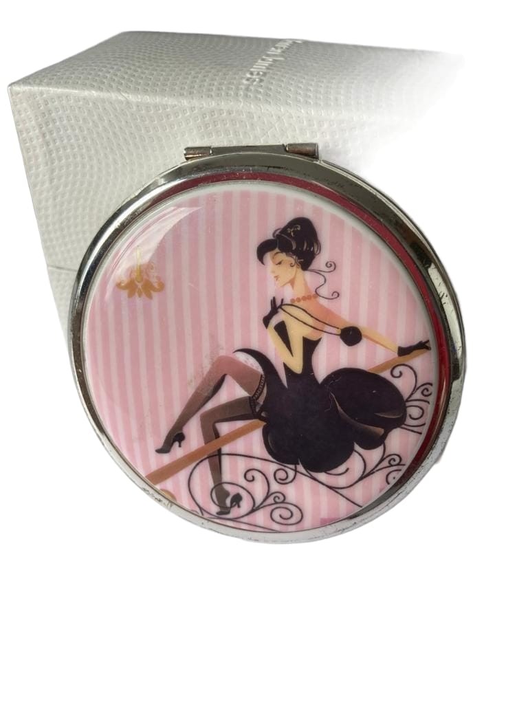 Vintage Stratton compact 1960s, having enamelled lid with provocative lady in black dress .Compact