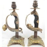 A pair of swords converted into lamp stands with Murano glass, tulip shape, lamp shades. The pair is