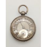 AN ORNATE FACED SILVER POCKET WATCH CIRCA 1890 WITH REAR KEY WIND , FWO BUT WITHOUT KEY