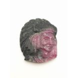 Carved natural ruby of a native American portrait, weight 14g