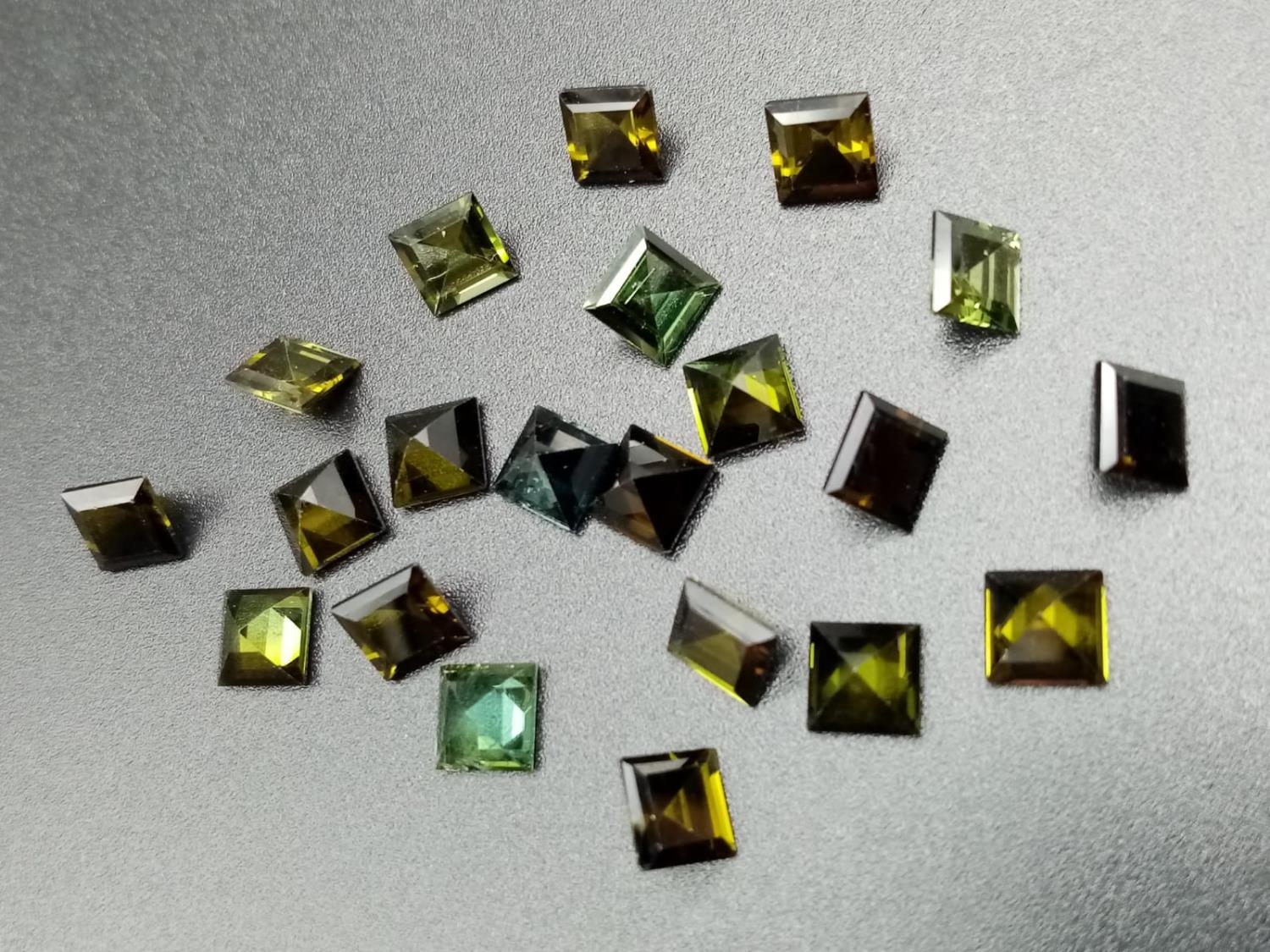 Parcel of 21 square cut green tourmaline total weight 13.36cts