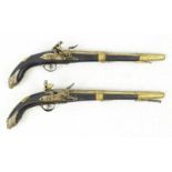 Quality pair of vintage reproduction wood and brass Flintlock pistols in working order. Length