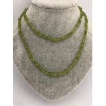 necklace set in peridot beads with brass clasp; 29.70g; 36inches approximately
