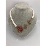 freshwater pearl necklace with rubies emeralds; silver gold plated; around 19inches;