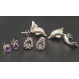 Pair of Silver Dolphin, Pair of Purple Stone and a Pair of White Stone Earrings. Total weight - 6.