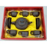 A Late 20th Century complete tea set of Yixing ware (also known as Zisha). In original