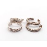 Two Pairs of Silver Hoop Earrings. 10.89g total weight.