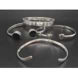 Four Sterling Silver Bangles. Different Thicknesses. 6cm diameters. 41.52g total weight.