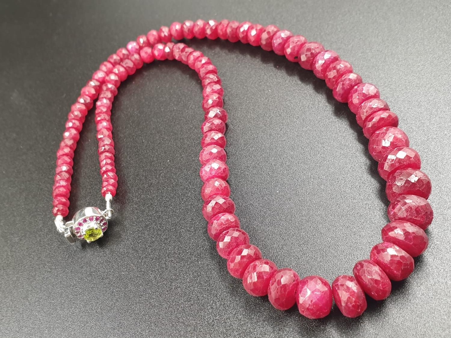 A 220cts single row Africa ruby necklace with a sterling silver ruby and peridot gemstone clasp 47cm