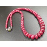 A 220cts single row Africa ruby necklace with a sterling silver ruby and peridot gemstone clasp 47cm