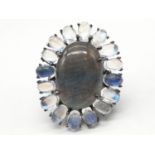 10.50 Ct Moonstones & 14.25 Ct Labradorite set within a blackened silver ring, weight 11.62g and