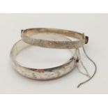 Two Silver Bangles. 5 1/2 and 6cm diameter. 40g