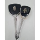A Vintage Silver-Plate Hand Mirror and Hair Brush. Black back with ornate decoration. Mirror-