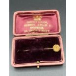 Antique Victorian stick pin with 15 carat gold top ,comes complete with vintage case.