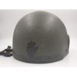 A British Army Ulster Defence Regiment Helmet from the 1970s. The Private is named on the helmet