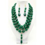 A triple necklace of faceted emerald beads and matching earrings set. Necklace length: 46-52cm,