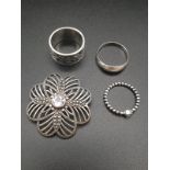 Three Silver Rings and a Purple-Stone Brooch. Sizes P, R and L. 19.36 total weight.