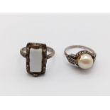 Two Antique Ladies White-Metal Rings. A Pearl - Size I and a White Enamel - Expandable.