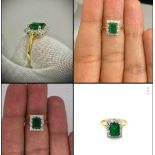 18k white gold ring set with a 1.21ct single halo emerald centre and approx 0.25ct diamonds on