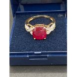 9 Carat Gold Ring having large raspberry gemstone mounted to top (tests as spinel )with Diamond