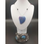 An Art Nouveau bracelet with blue crackled agate together with a blue crackled, heart shaped, agate,