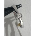 18k white gold solitaire ring with diamond around 0.15cts in bezel setting; 3.4g; size N