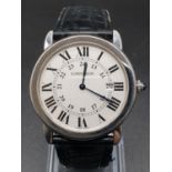 Cartier stainless steel watch, white round face Roman numerals and black leather strap, 32mm