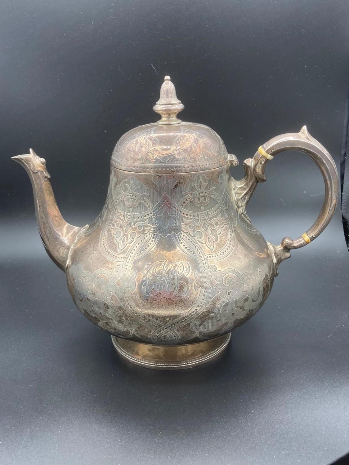 Large antique silver teapot covered in fabulous intricate chase work having clear hallmark for