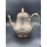 Large antique silver teapot covered in fabulous intricate chase work having clear hallmark for