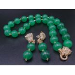 A Cartier Panther style, large beaded, high quality, green jade, necklace and matching earrings set,