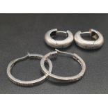 Two Pairs of Silver Hoop Earrings. 12.48g total weight.