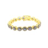 A 925 Silver Gold Plated Bracelet with 4.90ct of 20 pieces of Transparent Blue Oval Faceted