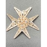 Silver Maltese cross having attractive filigree work and full Maltese hallmark for 917 silver.