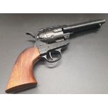 Gun Replica of an 1873 USA .45 Calibre Peacemaker. Black heavy metal, revolving cylinder, single-