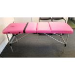 Fold-Away Professional Pink Massage Table. 6ft in length when fully extended. Slight tear in
