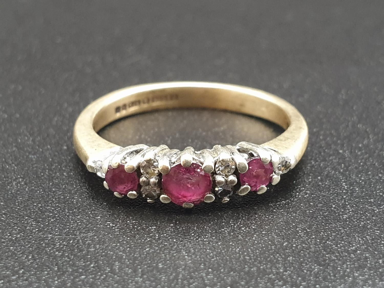 9k Yellow Gold Three Stone Ruby and Diamond Ring. Size J. 2.08g