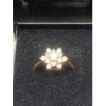 9 carat gold cluster ring in flower formation ,2.5 grams approx, Size M/N.