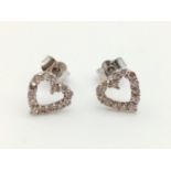 Pair of 18k white gold diamond heart shaped earrings (1 small diamond missing)