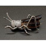 David Rosas Italian brooch in the form of a grasshopper set in 18k white gold , weight 13.57g and