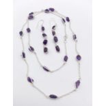 A raw amethyst gemstone necklace with matching dangler earrings in 925 silver