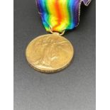 World War one victory medal awarded to PRIVATE A.E.WOOD. of the Gloucester Regiment ,complete with
