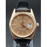 18k yellow gold gents watch with rose gold face and black leather strap. 36mm