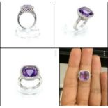 18k white gold ring set with large amethyst centre and surrounded by cushion halo diamonds, weight