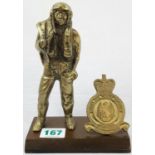 Vintage heavy brass figure and shield on wooden base representing RAF Manston