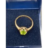 9 carat gold and Peridot ring, having large single stone to top .2.3 grams approx, Size P.